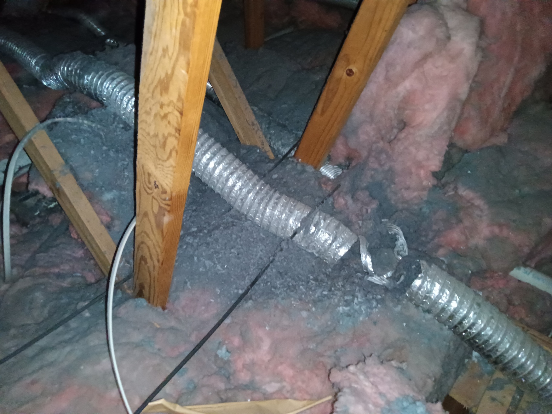 Non-code dryer vent transition duct in attic flagged during cleaning in Grantham NH